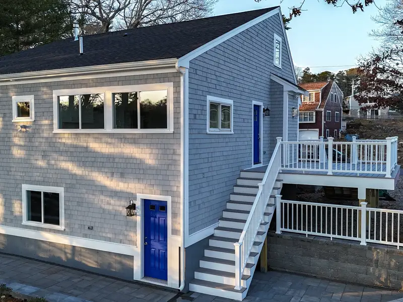 Aerial view of a finished elevated deck with white railing