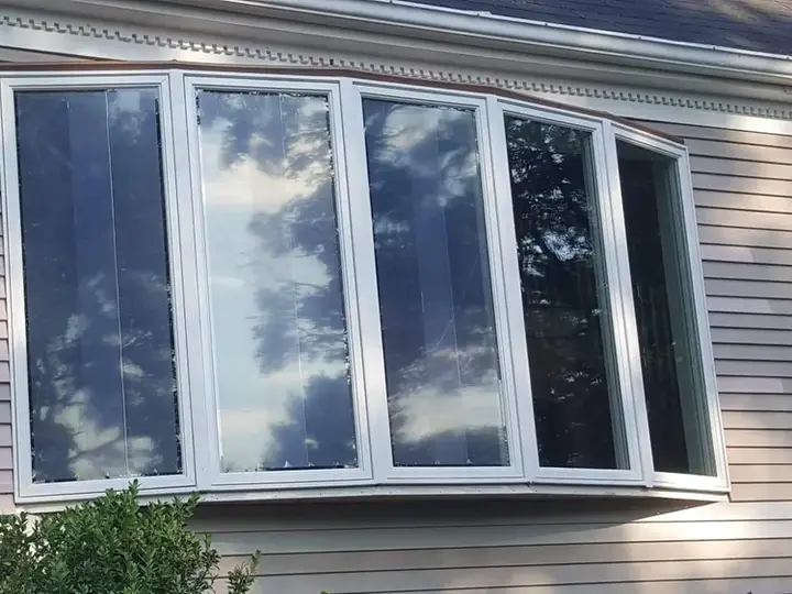Bow window installation on a Cape Cod home